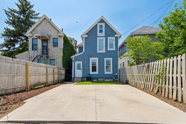 1140 Summit St, Columbus, OH 43201 - view of front of property with a fenced backyard and central AC