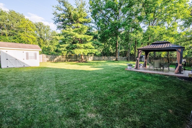 3476 Bayspirit Ct, Reynoldsburg, OH 43068 - fenced backyard with a gazebo, a patio area, a shed, and view of scattered trees