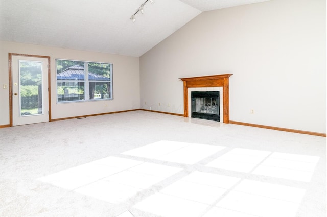 3476 Bayspirit Ct, Reynoldsburg, OH 43068 - unfurnished living room with vaulted ceiling, rail lighting, a tiled fireplace, and carpet