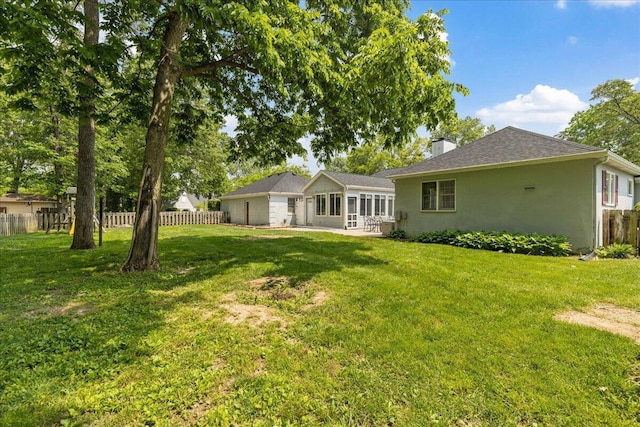 685 Hawthorne Dr, Circleville, OH 43113 - back of house featuring a chimney, stucco siding, a patio, and roof with shingles
