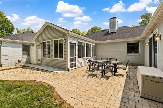 685 Hawthorne Dr, Circleville, OH 43113 - back of house featuring a chimney, a patio, brick siding, and a shingled roof