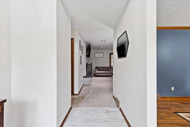685 Hawthorne Dr, Circleville, OH 43113 - corridor featuring baseboards and marble look tiles