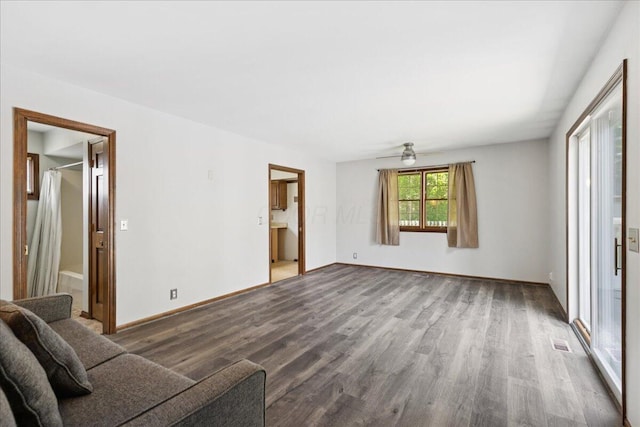 685 Hawthorne Dr, Circleville, OH 43113 - unfurnished living room featuring wood finished floors, a ceiling fan, and baseboards