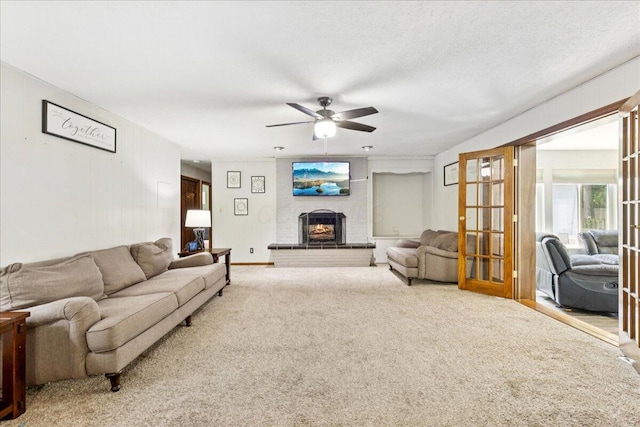 685 Hawthorne Dr, Circleville, OH 43113 - carpeted living area featuring ceiling fan and a brick fireplace