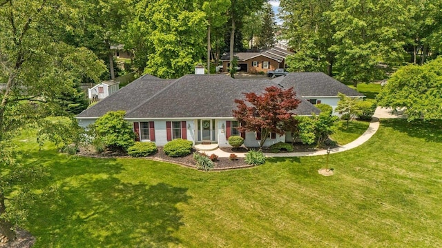 685 Hawthorne Dr, Circleville, OH 43113 - view of front of property featuring a front lawn, roof with shingles, and view of scattered trees