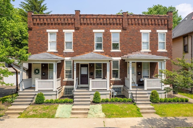 994 Delaware Ave, Columbus, OH 43201 - view of property with covered porch and brick siding