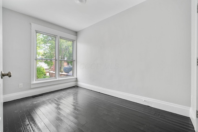 994 Delaware Ave, Columbus, OH 43201 - unfurnished room featuring baseboards and dark wood-type flooring
