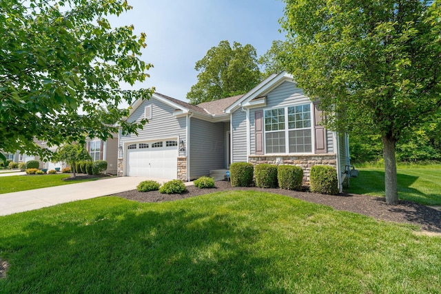 140 Broadstone Cir E, Blacklick, OH 43004 - view of front facade with stone siding, an attached garage, a front yard, and driveway