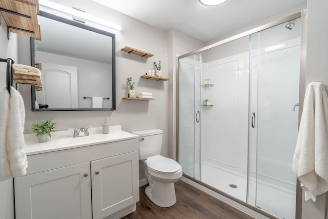 140 Broadstone Cir E, Blacklick, OH 43004 - full bathroom with wood finished floors, vanity, toilet, and a stall shower