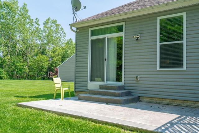 140 Broadstone Cir E, Blacklick, OH 43004 - entrance to property with a patio, a lawn, and a shingled roof