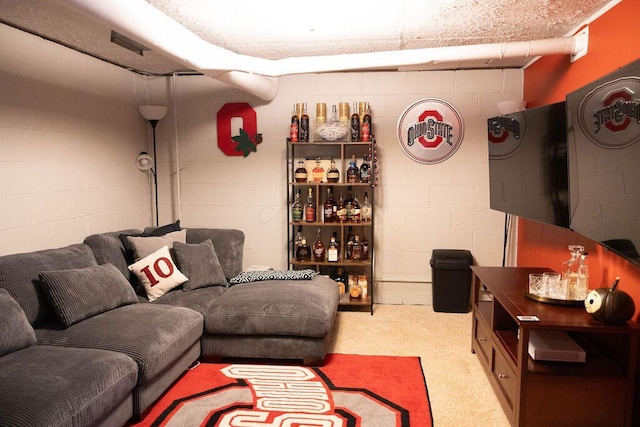 1771 Redcloud Dr, Powell, OH 43065 - carpeted living room featuring concrete block wall
