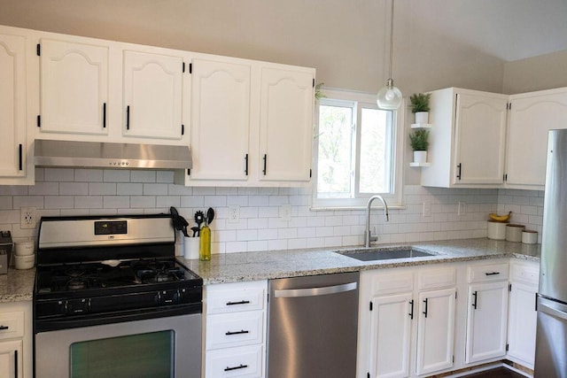 1771 Redcloud Dr, Powell, OH 43065 - kitchen with appliances with stainless steel finishes, extractor fan, a sink, white cabinets, and decorative backsplash