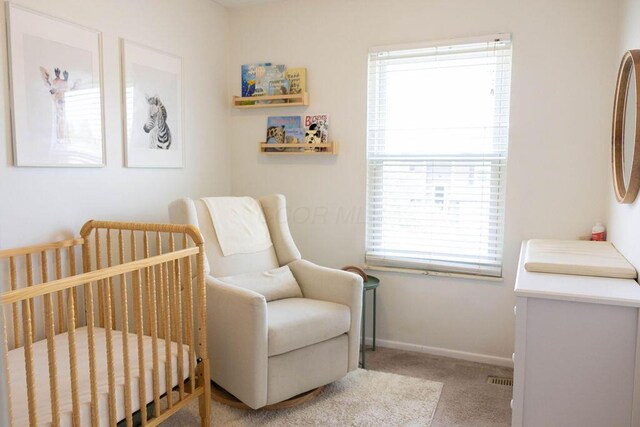1771 Redcloud Dr, Powell, OH 43065 - carpeted bedroom featuring a crib and baseboards