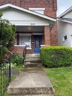 863 E Whittier St, Columbus, OH 43206 - property entrance featuring brick siding