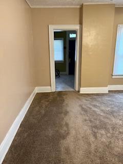 863 E Whittier St, Columbus, OH 43206 - empty room with baseboards and carpet