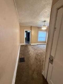863 E Whittier St, Columbus, OH 43206 - corridor with dark carpet, baseboards, a textured ceiling, and crown molding