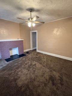 863 E Whittier St, Columbus, OH 43206 - unfurnished living room with ceiling fan, a fireplace, baseboards, and carpet