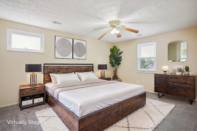 2117 Kilbourne Ave, Columbus, OH 43229 - bedroom with carpet, baseboards, a ceiling fan, and a textured ceiling