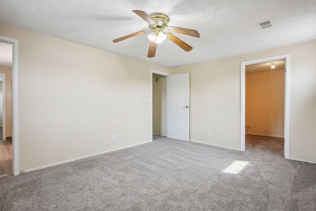 2117 Kilbourne Ave, Columbus, OH 43229 - unfurnished bedroom with carpet, attic access, baseboards, and ceiling fan