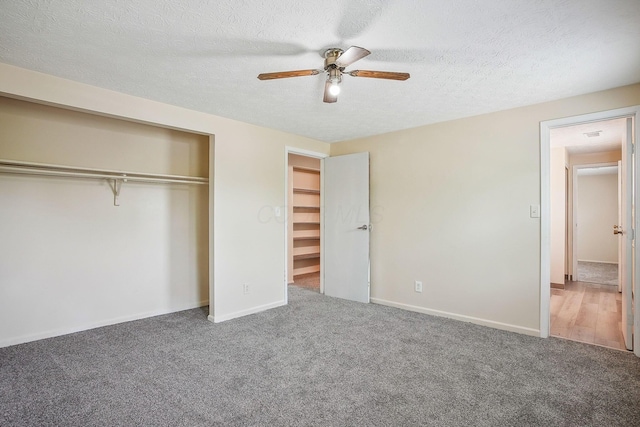 2117 Kilbourne Ave, Columbus, OH 43229 - unfurnished bedroom with carpet, a closet, a textured ceiling, baseboards, and ceiling fan