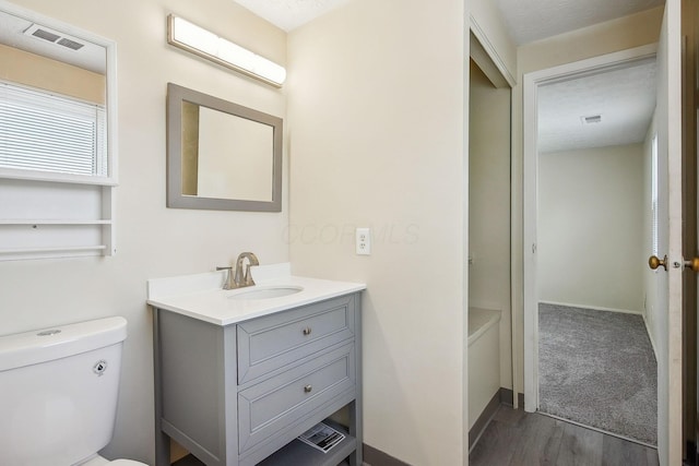 2117 Kilbourne Ave, Columbus, OH 43229 - bathroom with vanity, wood finished floors, and toilet