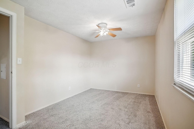 2117 Kilbourne Ave, Columbus, OH 43229 - carpeted spare room with a ceiling fan, baseboards, and a textured ceiling