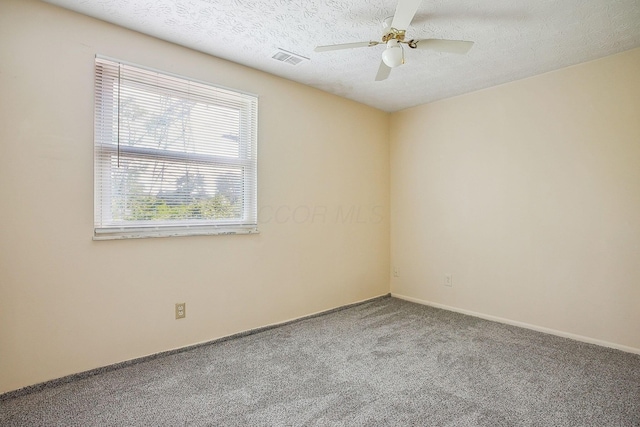 2117 Kilbourne Ave, Columbus, OH 43229 - unfurnished room featuring carpet, a ceiling fan, baseboards, and a textured ceiling