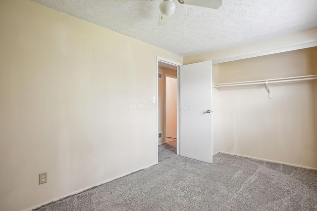 2117 Kilbourne Ave, Columbus, OH 43229 - unfurnished bedroom with carpet flooring, a textured ceiling, a closet, ceiling fan, and baseboards