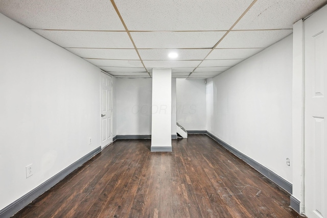 2117 Kilbourne Ave, Columbus, OH 43229 - finished basement with a paneled ceiling, dark wood-style floors, baseboards, stairway, and baseboard heating