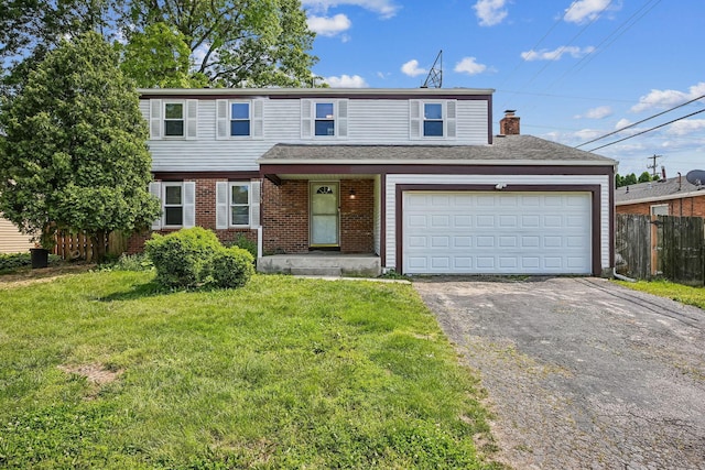 2117 Kilbourne Ave, Columbus, OH 43229 - view of front of property with asphalt driveway, brick siding, and a chimney