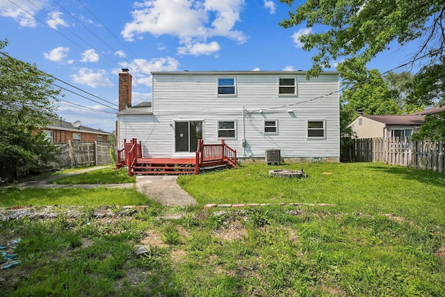 2117 Kilbourne Ave, Columbus, OH 43229 - rear view of property featuring a wooden deck, a chimney, and central air condition unit