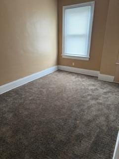 865 E Whittier St, Columbus, OH 43206 - carpeted spare room featuring baseboards