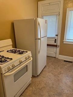 865 E Whittier St, Columbus, OH 43206 - kitchen with gas range gas stove and white cabinetry