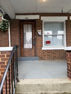 865 E Whittier St, Columbus, OH 43206 - doorway to property featuring brick siding