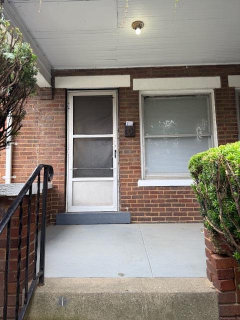 869 E Whittier St, Columbus, OH 43206 - property entrance featuring brick siding