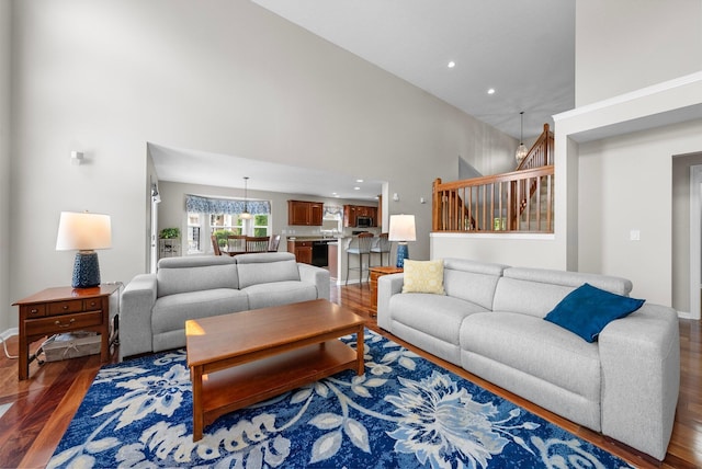 7494 Barrister Dr, Dublin, OH 43016 - living area with a high ceiling, wood finished floors, stairs, recessed lighting, and baseboards