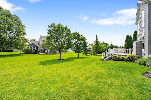 7494 Barrister Dr, Dublin, OH 43016 - view of grassy yard with a deck