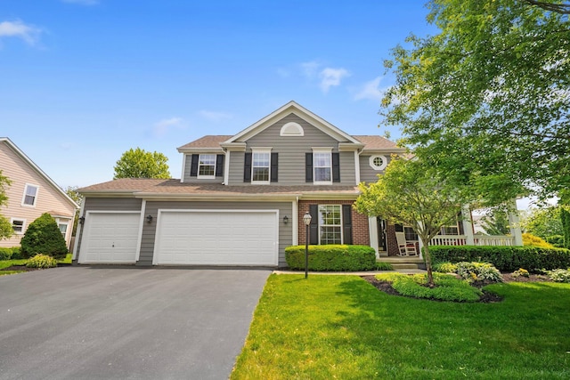 7494 Barrister Dr, Dublin, OH 43016 - traditional home featuring asphalt driveway, a front yard, and an attached garage