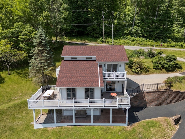 14 Wells Jones Rd, Waverly, OH 45690 - rear view of house featuring a wooden deck, a shingled roof, and a lawn