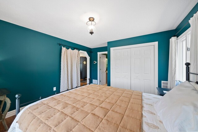 14 Wells Jones Rd, Waverly, OH 45690 - bedroom with a closet, wood finished floors, and baseboards
