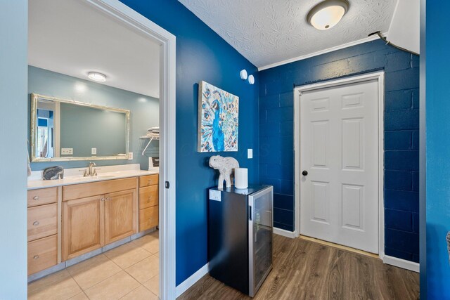 14 Wells Jones Rd, Waverly, OH 45690 - bathroom with vanity, a textured ceiling, wood finished floors, and baseboards
