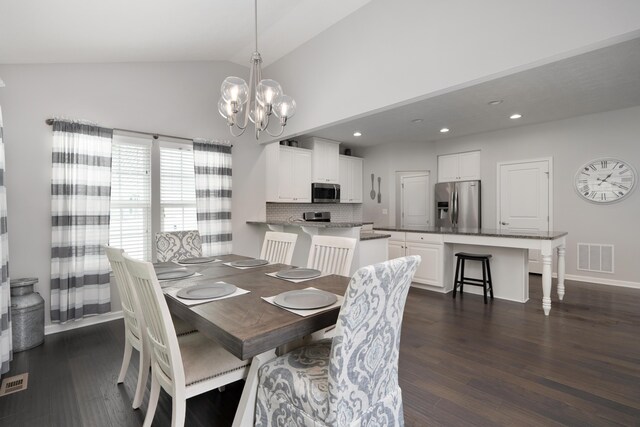 676 Ferguson Ave, Delaware, OH 43015 - dining area with a chandelier, dark wood-style flooring, vaulted ceiling, baseboards, and recessed lighting