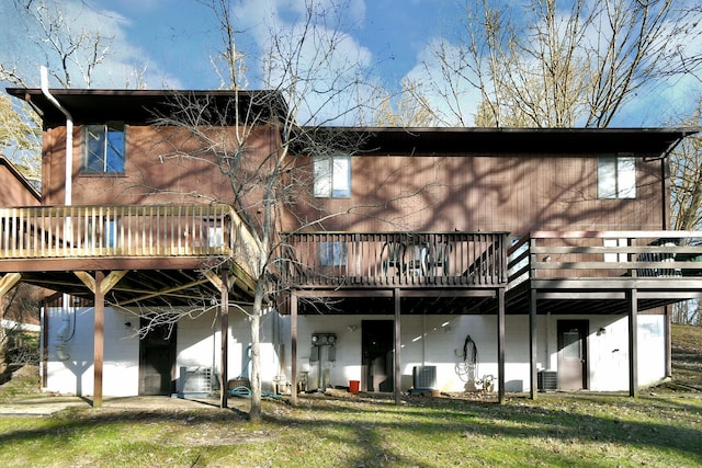 1442 Londondale Unit 3-3, Newark, OH 43055 - back of property with a wooden deck, a lawn, and central air condition unit