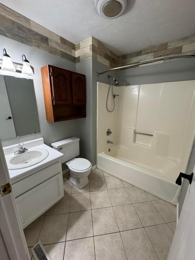 1442 Londondale Unit 3-3, Newark, OH 43055 - bathroom featuring toilet, bathing tub / shower combination, a textured ceiling, vanity, and tile patterned flooring