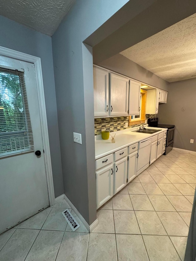 1442 Londondale Unit 3-3, Newark, OH 43055 - kitchen with range with electric stovetop, a textured ceiling, light tile patterned flooring, backsplash, and white cabinets