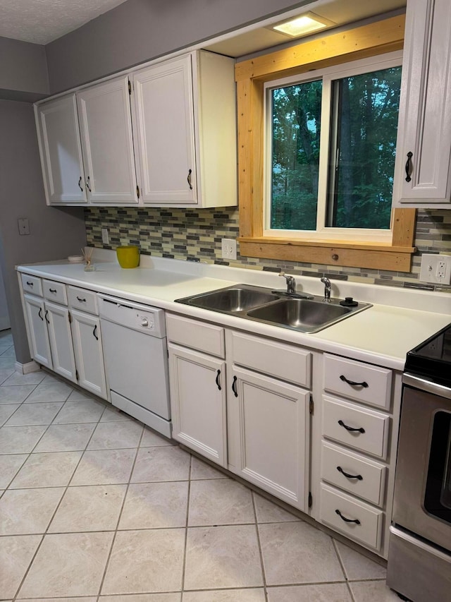 1442 Londondale Unit 3-3, Newark, OH 43055 - kitchen featuring white dishwasher, a sink, range, light tile patterned floors, and backsplash