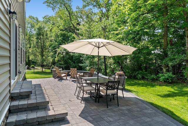 1211 Mcclish Ct, Grove City, OH 43123 - view of patio featuring outdoor dining space and view of wooded area