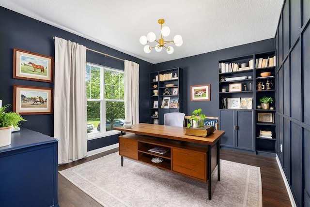 1211 Mcclish Ct, Grove City, OH 43123 - home office featuring a chandelier, dark wood-type flooring, and a textured ceiling