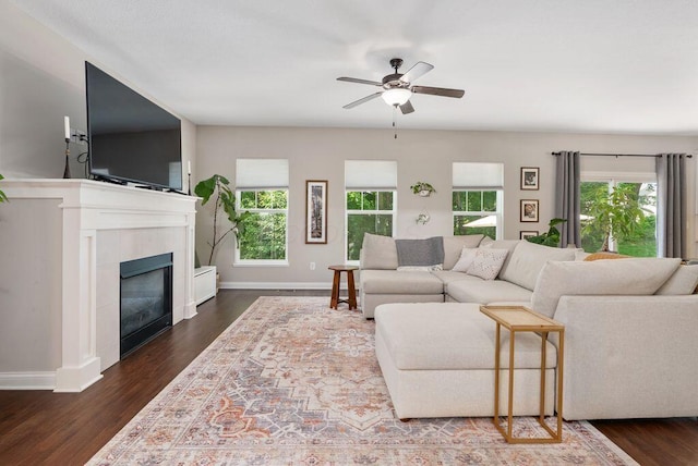 1211 Mcclish Ct, Grove City, OH 43123 - living room featuring healthy amount of natural light, ceiling fan, dark wood-style floors, and a tile fireplace