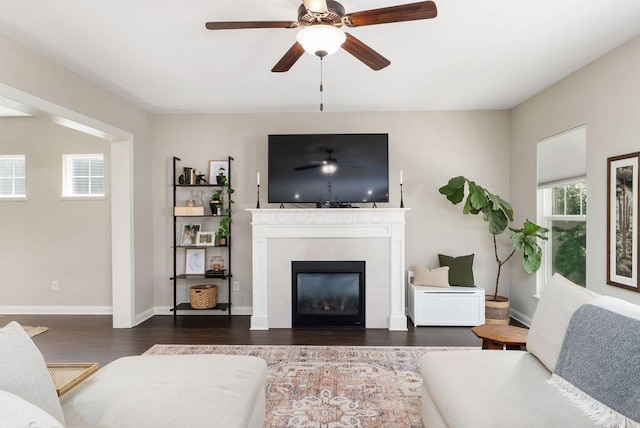 1211 Mcclish Ct, Grove City, OH 43123 - living room featuring wood finished floors, a ceiling fan, a tile fireplace, and baseboards